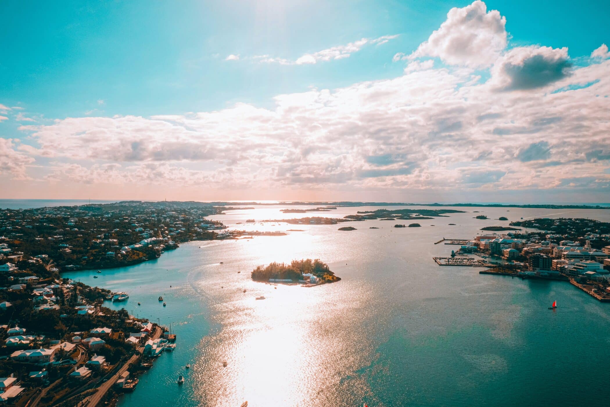 View of the Bermuda coastline with sun on the water.